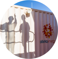 An image of an Alinta Energy container with the shadow of two workers on it.