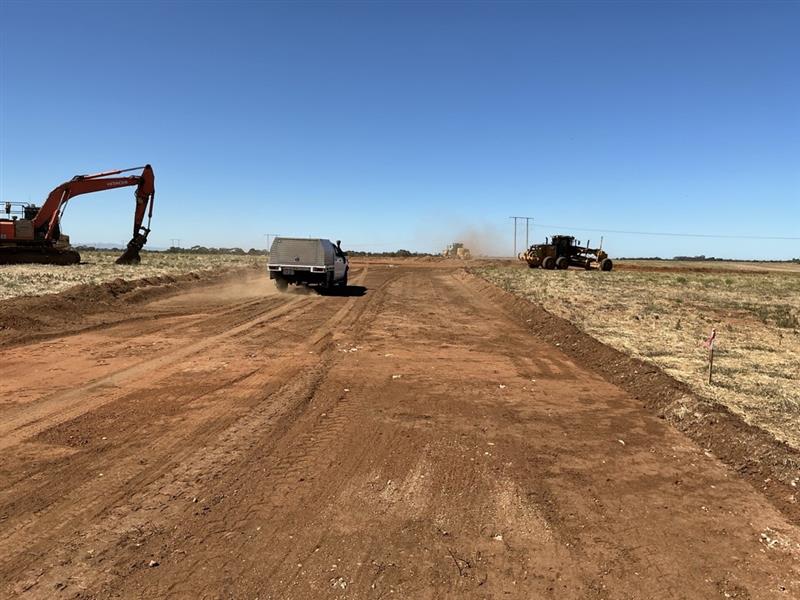 Green fields, blue sky and rolling clouds.